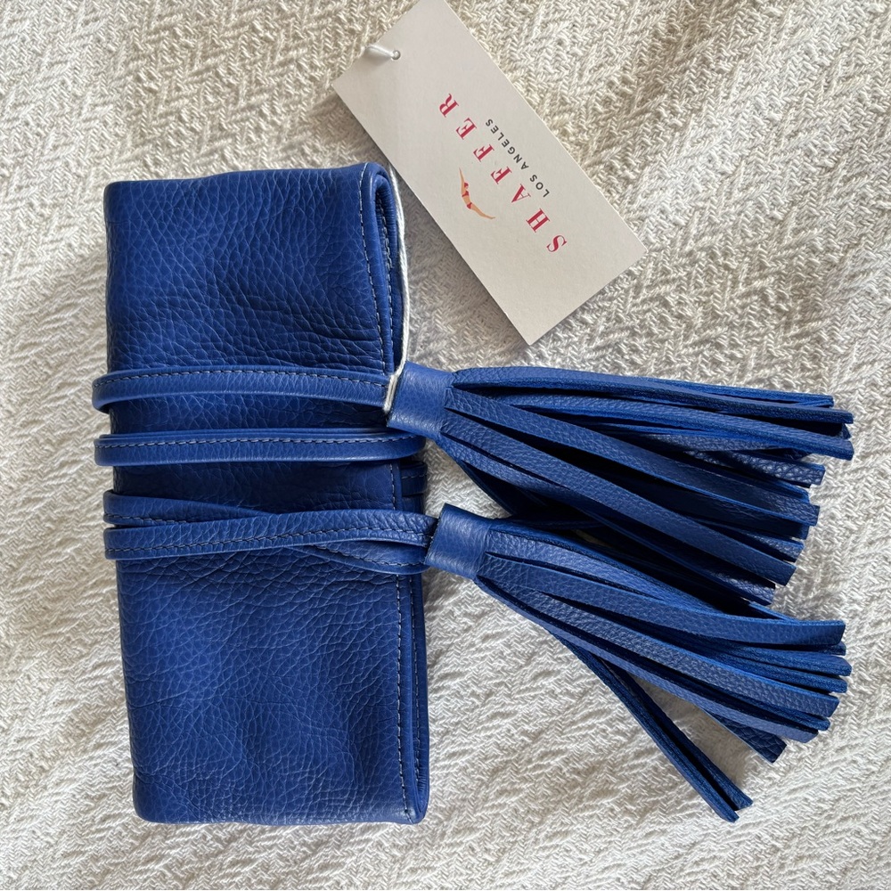 Schaffer Los Angeles royal blue leather clutch with ties and tassels